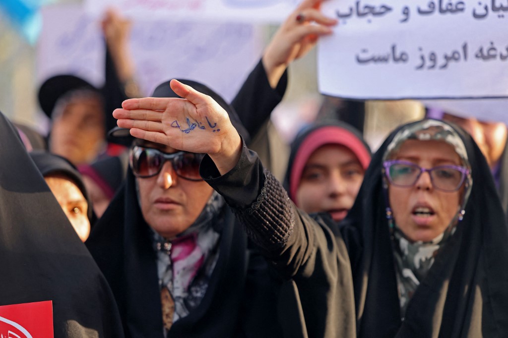 Iranian women attend a pro-hijab rally in Tehran on 12 July 2023 (AFP)