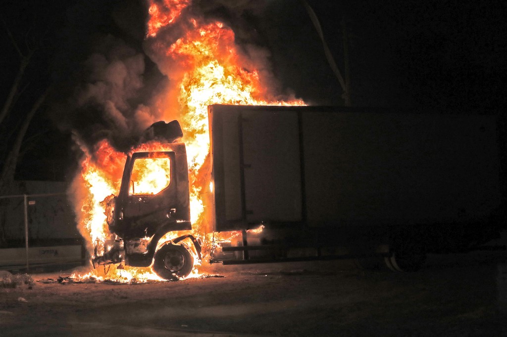 A truck burns at the entrance of the mixed Jewish-Arab city of Lod, where a state of emergency has been declared following civil unrest, on May 12, 2021