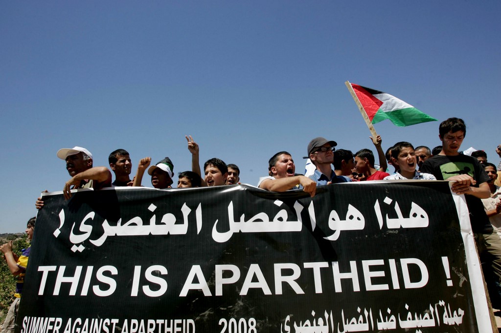 Protesters rally against the construction of Israel’s separation wall in Jayus village in 2008 (AFP)