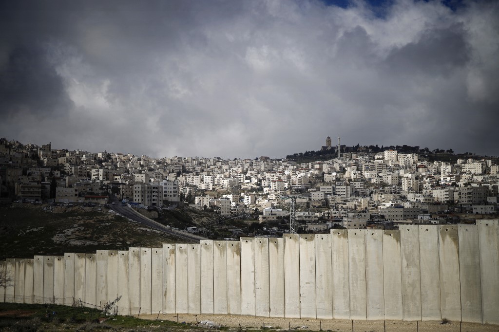 Israel’s separation wall is pictured on 17 January (AFP)