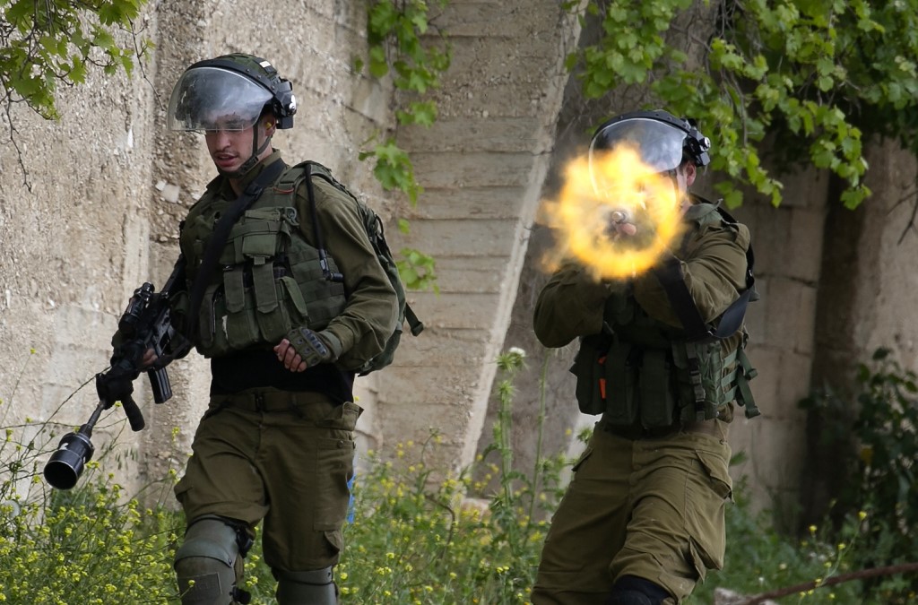 Israeli forces target Palestinian demonstrators in the occupied West Bank on 17 April (AFP)