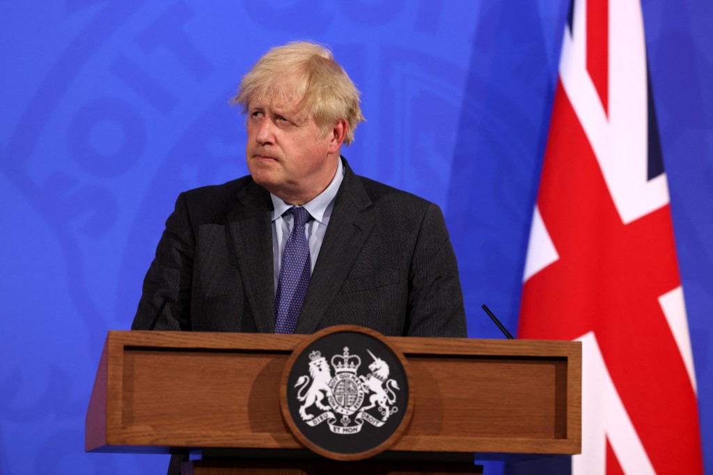 British Prime Minister Boris Johnson speaks to the media in central London on 14 June 2021 (AFP)