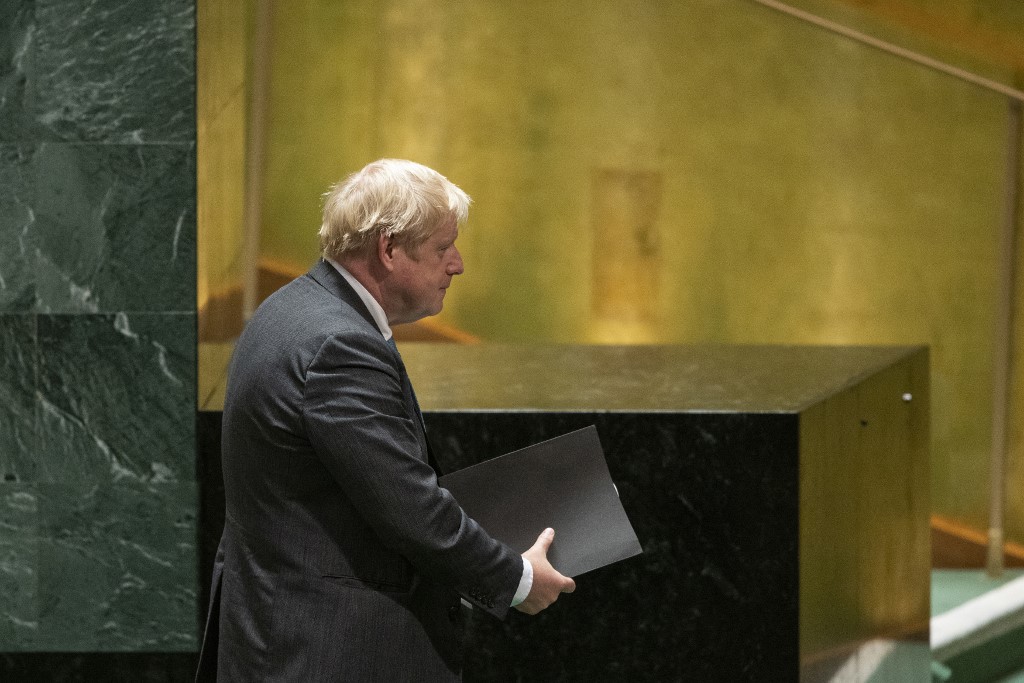 British Prime Minister Boris Johnson exits the UN General Assembly in New York on 22 September 2021 (AFP)