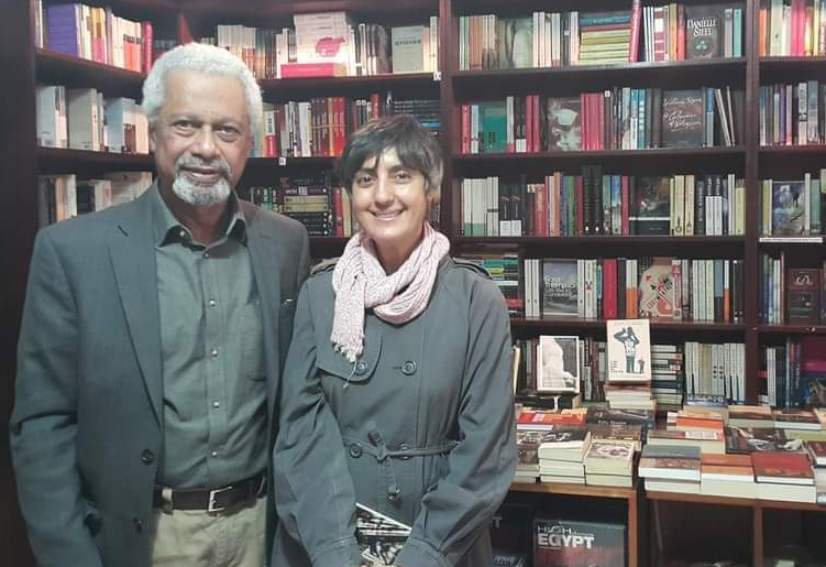 Kotob Khan owner, Karam Youssef, poses with visiting Nobel prize winning author, Abdulrazaq Gurnah (credit)