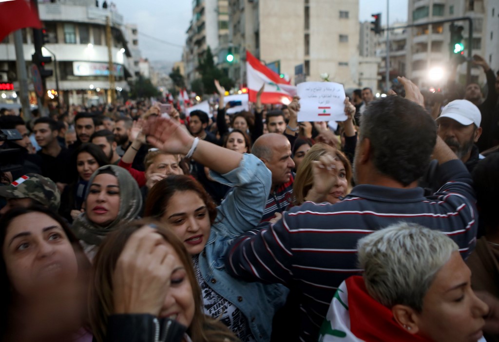 Lebanese protesters march in Beirut on 27 November (AFP)