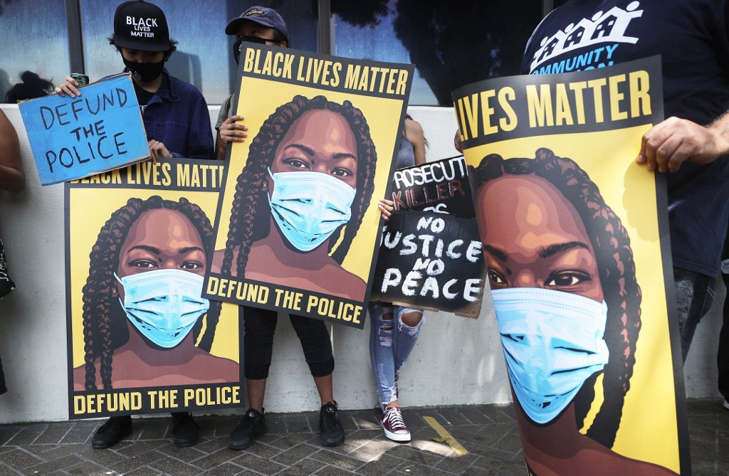 Black Lives Matter supporters protest in Los Angeles on 23 June (AFP)