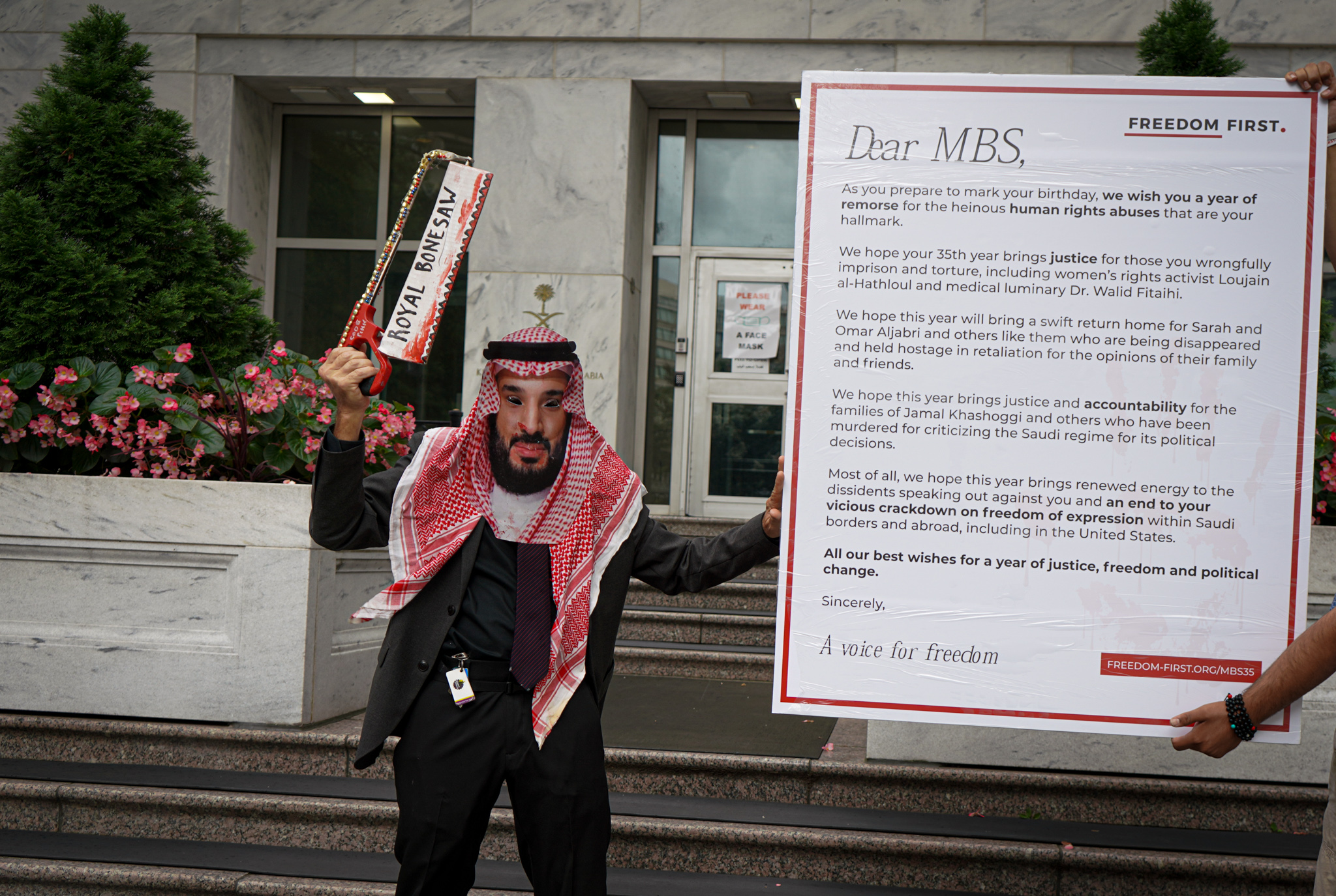 A person wearing a mask of Saudi Crown Prince Mohammed bin Salman standing in protest outside the Saudi embassy in Washington.