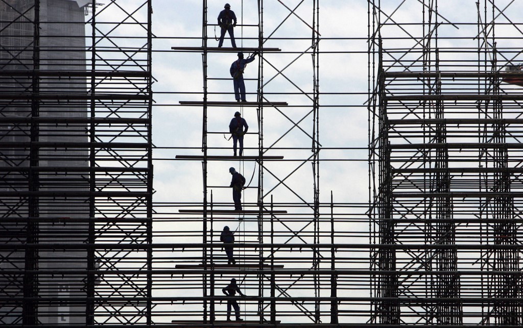Migrant workers are pictured at a construction site in Dubai in 2007 (AFP)