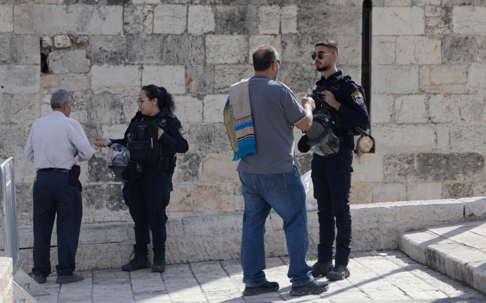 Israeli police checking Palestinians near Al Aqsa compound.