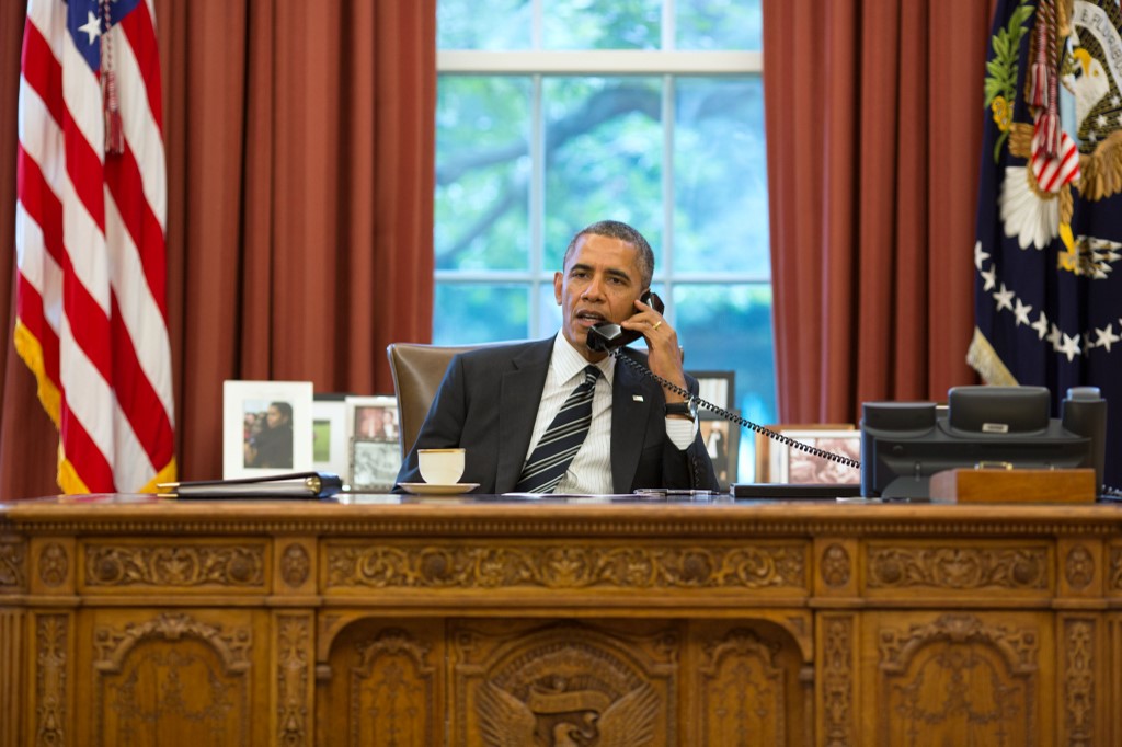 President Barack Obama speaks with Iranian President Hassan Rouhani during a phone call in the Oval Office in 2013 (The White House/Pete Souza/AFP)