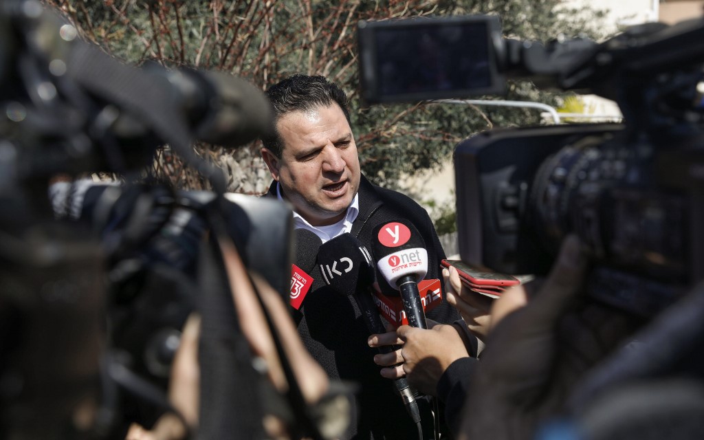 Joint List leader Ayman Odeh speaks to reporters in Haifa, Israel, on 3 March (AFP)