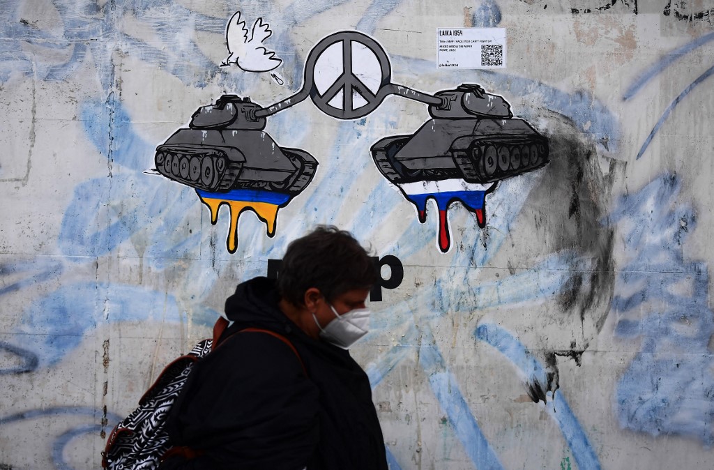 A painting is seen on a house near Russia’s embassy in Rome on 24 February 2022 (AFP)