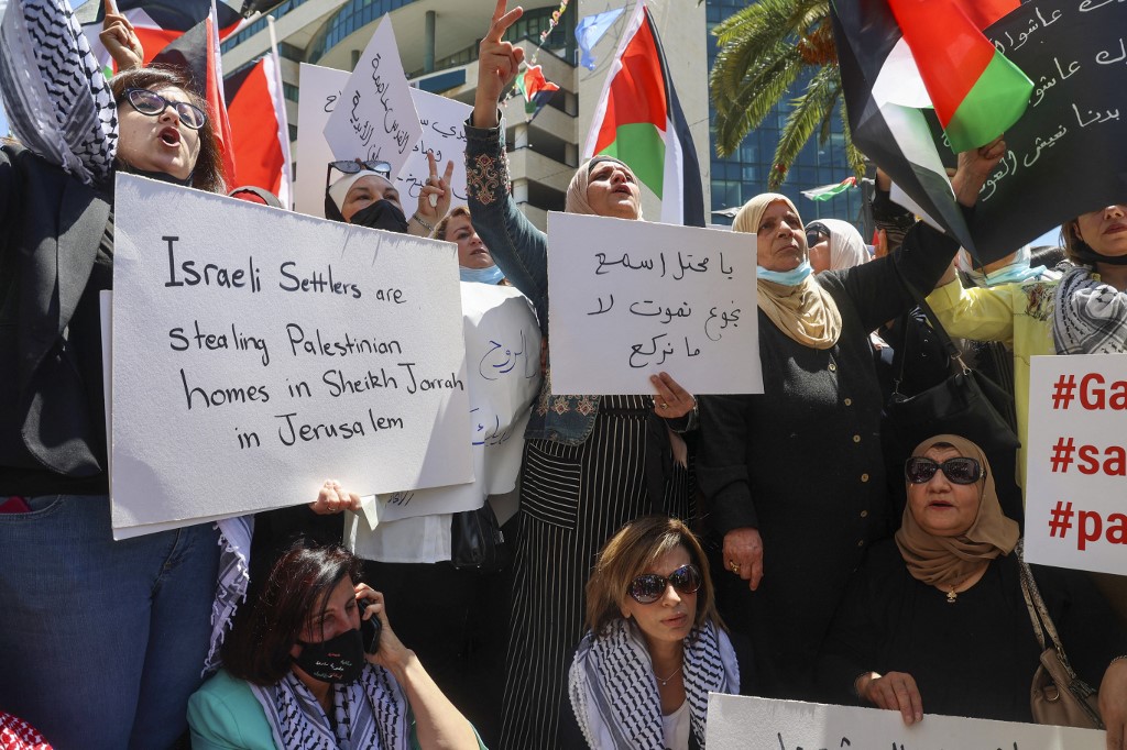 Palestinians protest in the occupied West Bank city of Nablus on 19 May 2021 (AFP)