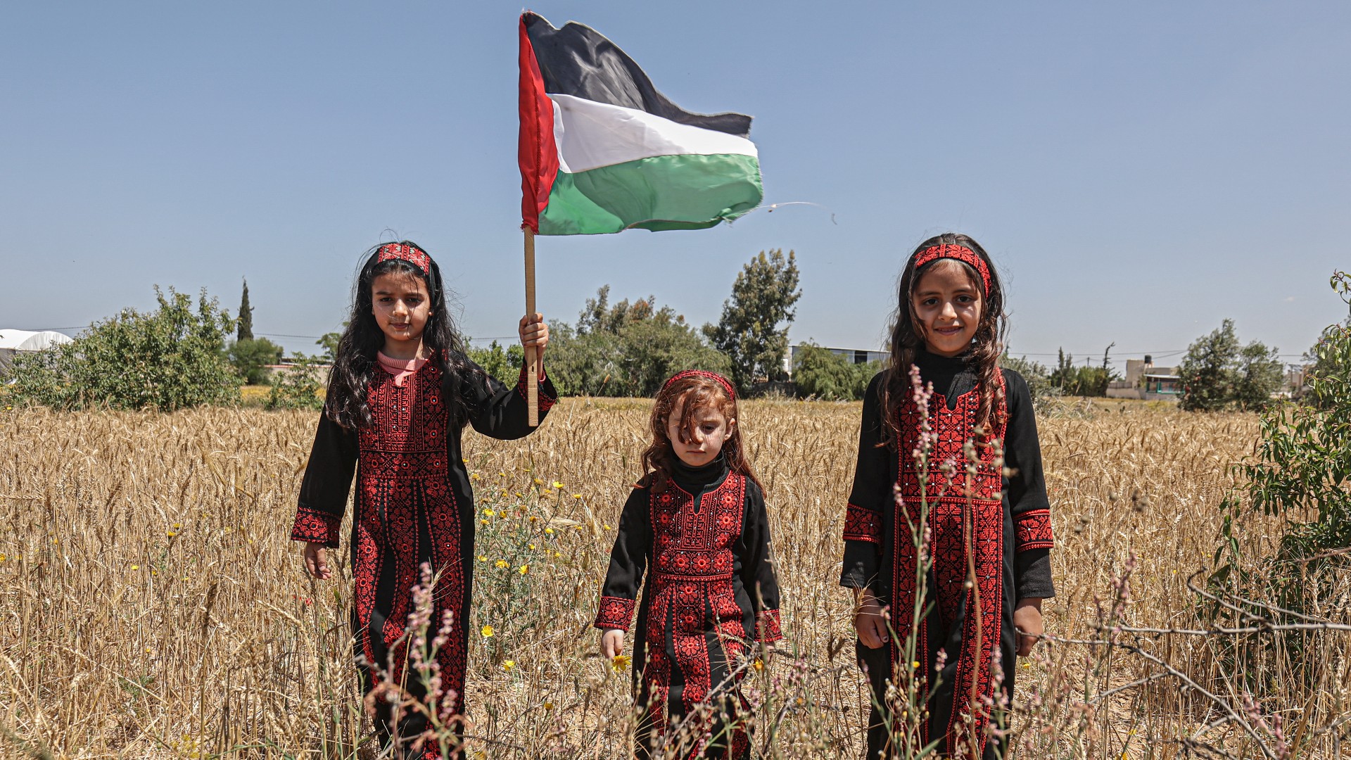 Girls take part in a rally along the border east of Khan Yunis in the southern Gaza Strip on May 1, 2023 marking the 75th anniversary of the Nakba.