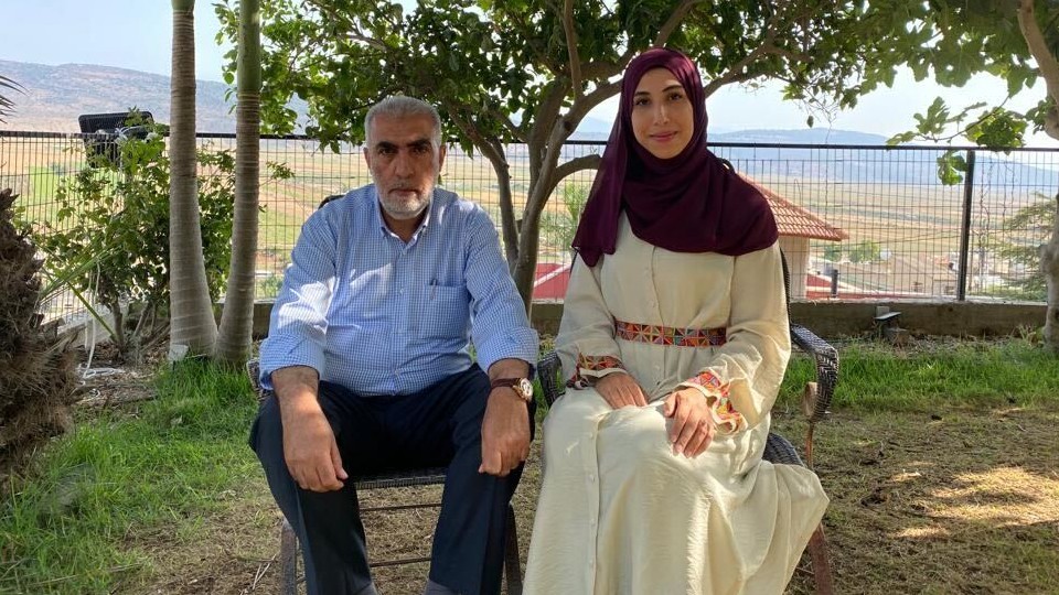 Safaa Khatib posing with her father at their home in Kafr Kana (Supplied)