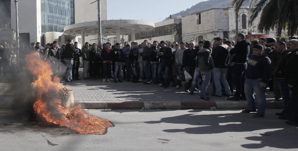 Palestinians in Nablus protest against Fayyad’s leadership in 2012 (AFP)