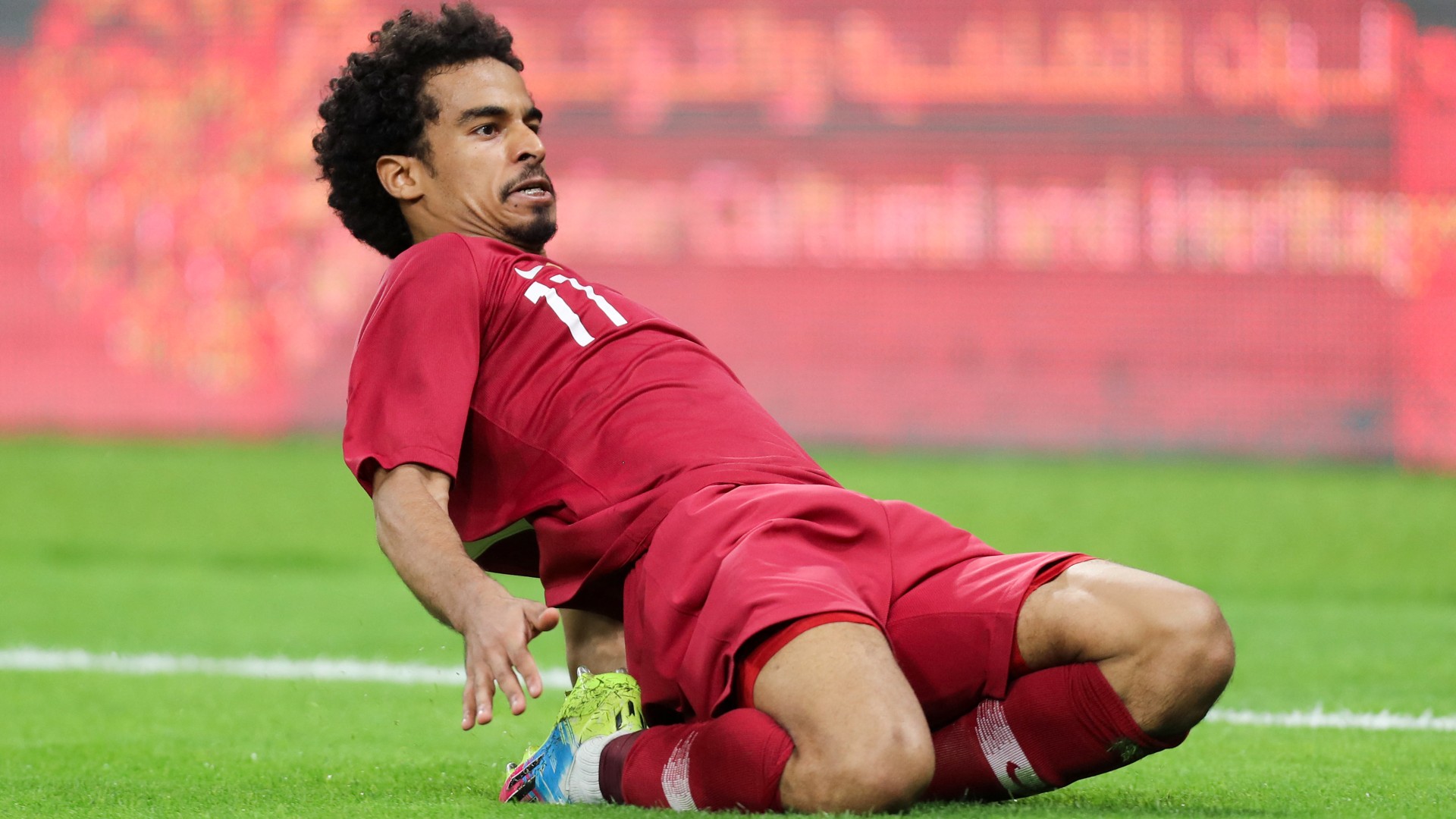 Qatar's Akram Afif celebrates his goal during the 24th Arabian Gulf Cup Group A football match against the United Arab Emirates at the Khalifa International Stadium in Doha on 2 December, 2019 (AFP)