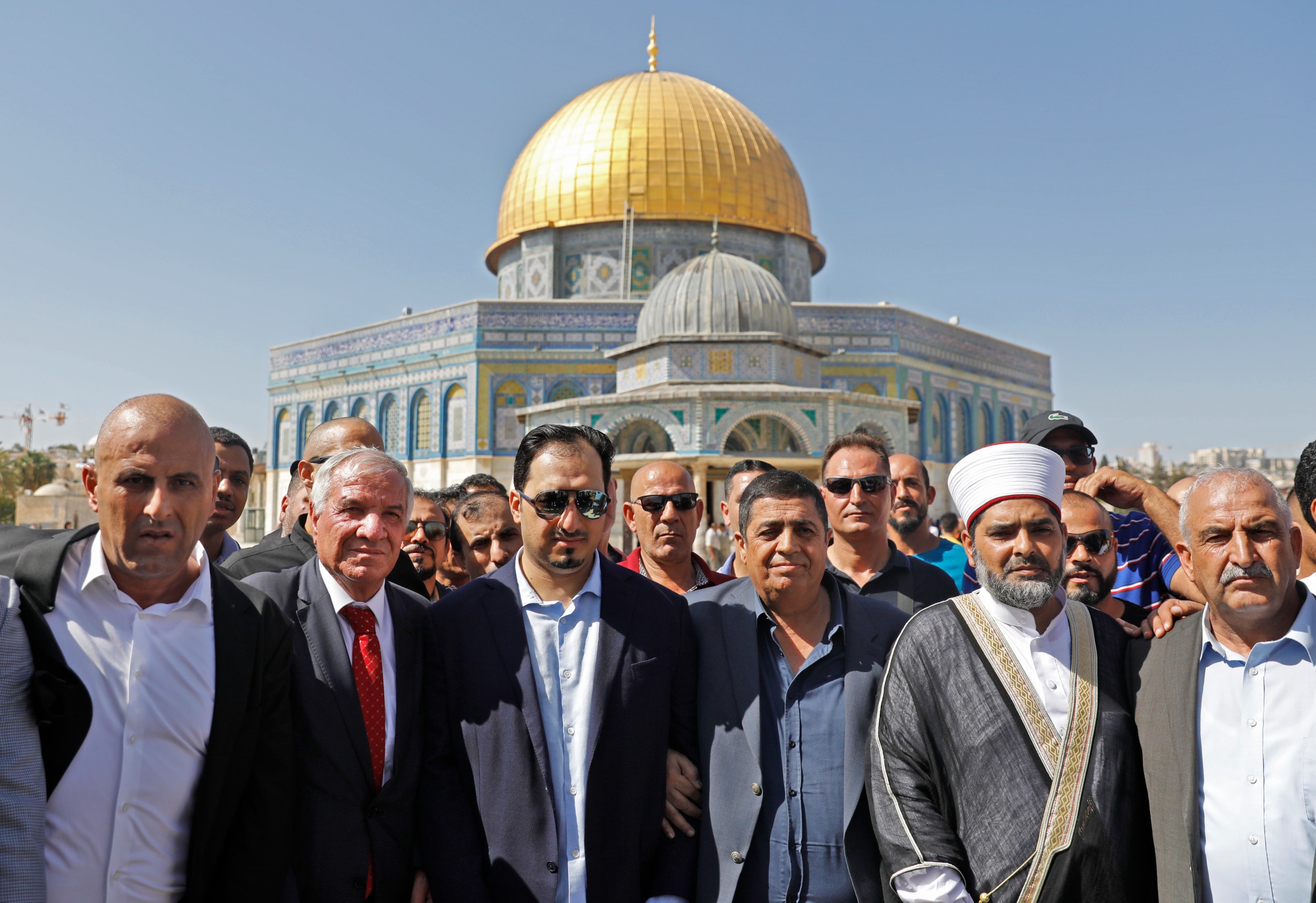 Saudi Football Federation chief Yasser Almisehal, centre, and members of the Saudi football delegation visit the Al-Aqsa Mosque compound in the Old City of Jerusalem on 14 October 2019 (AFP)