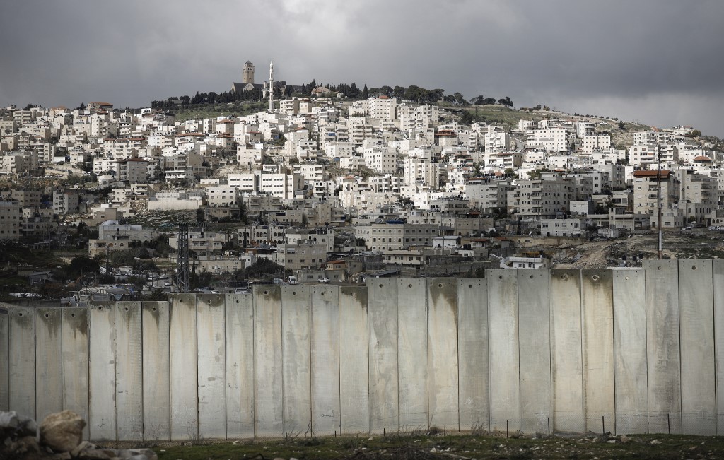 Israel’s separation wall is pictured on 17 January (AFP)