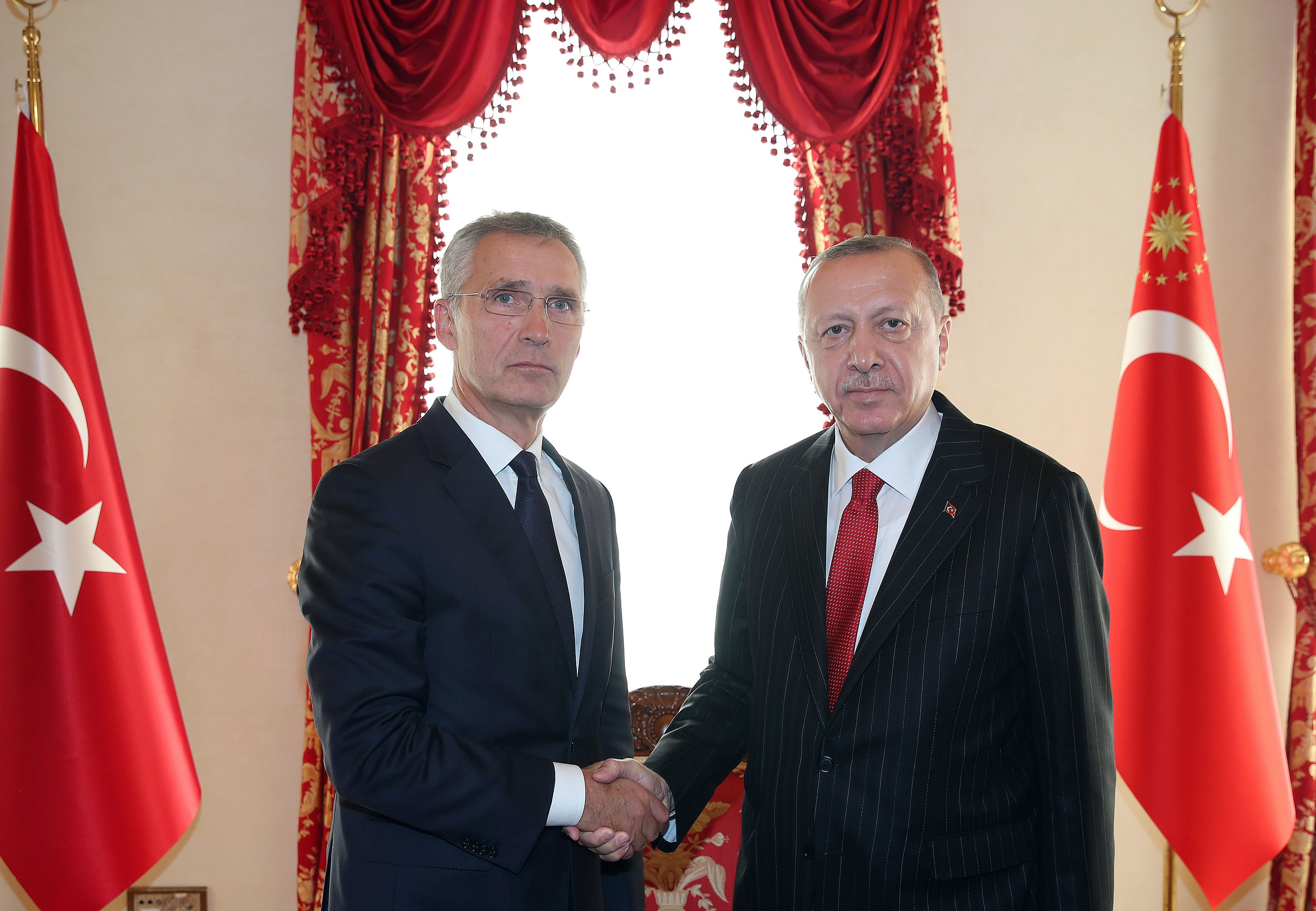 'I shared... my serious concerns about this ongoing operation and the risk of further destabilisation of the region,' said Stoltenberg, left (AFP/Turkish Presidential Press Service)