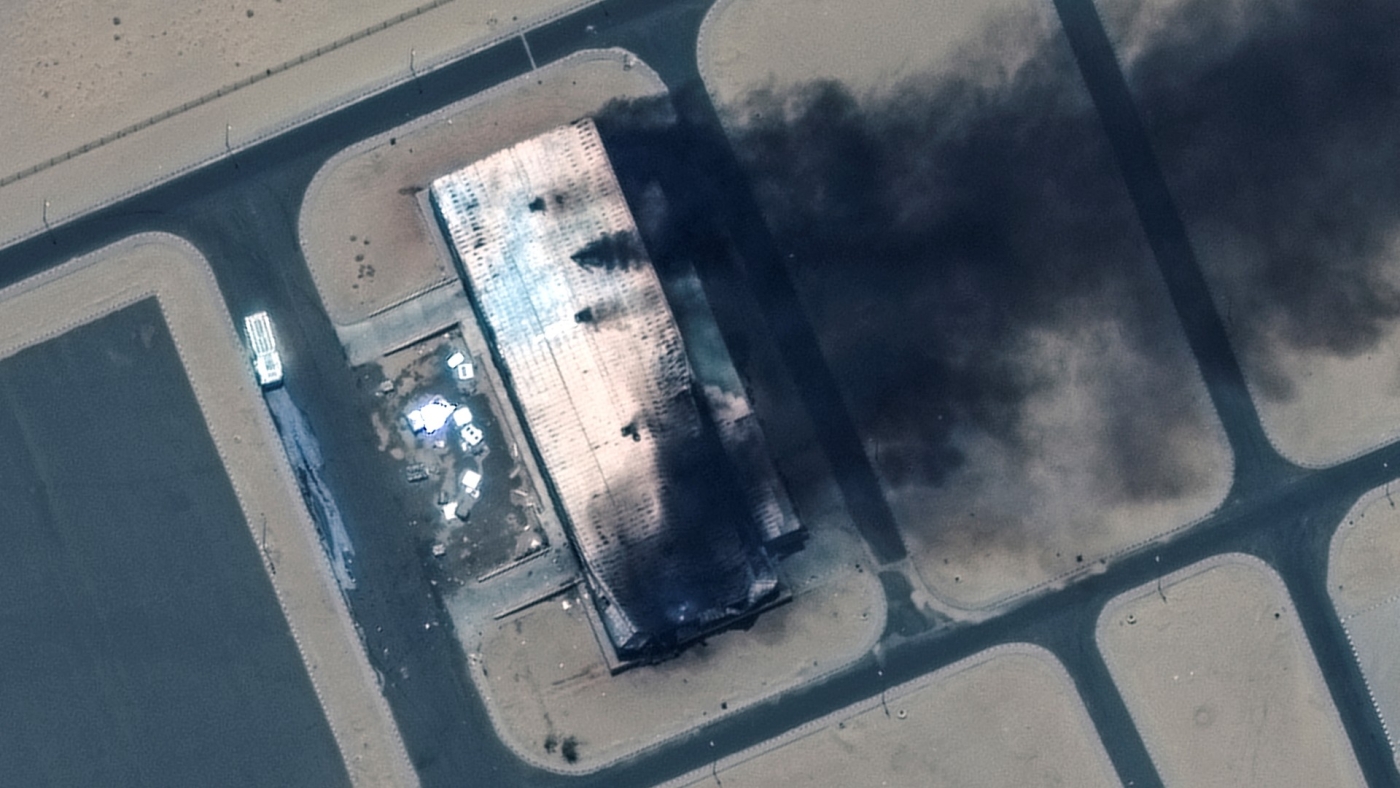 Satellite image shows a closer view of a burning building at the Merowe Airbase (Reuters)