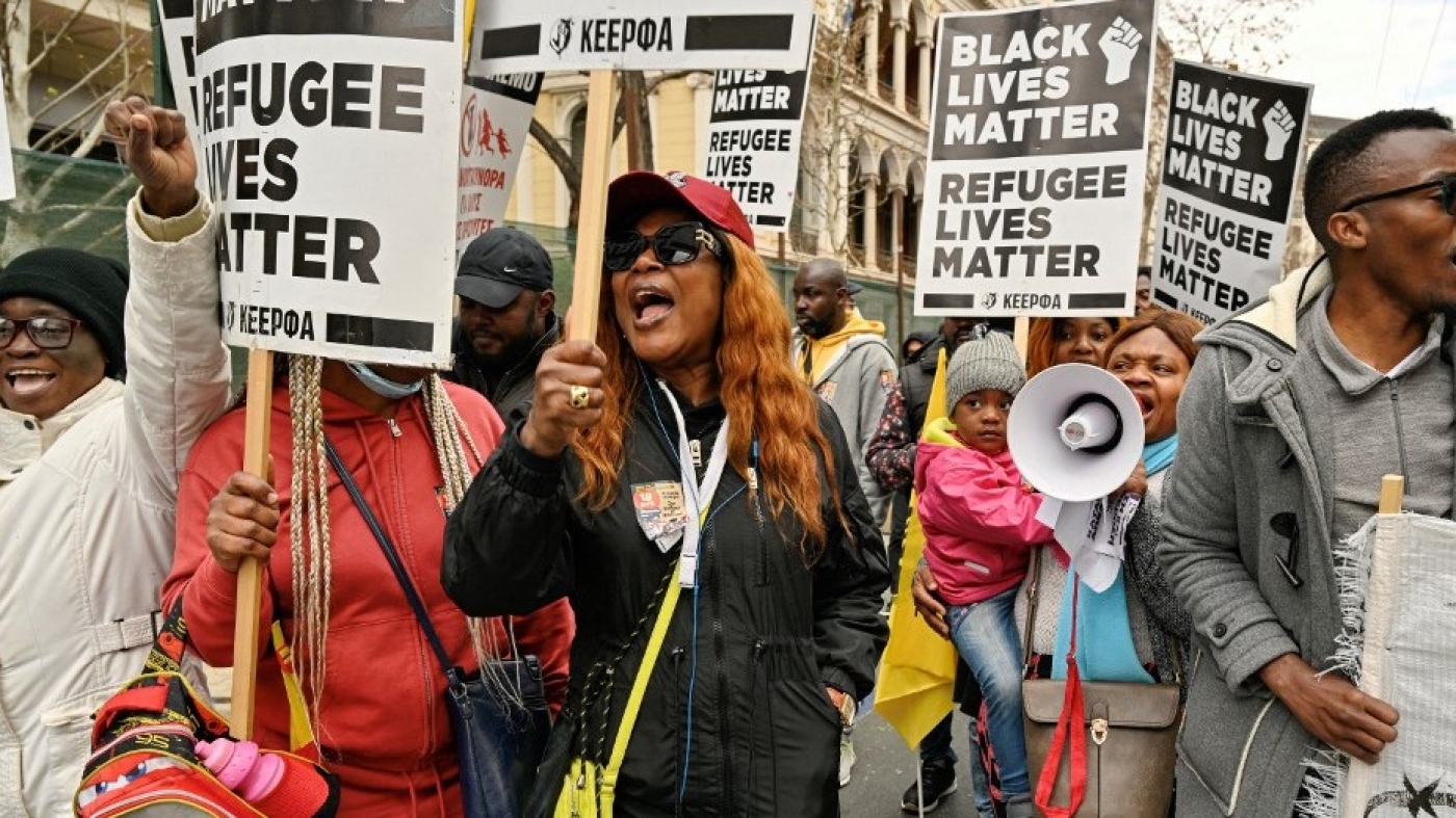 Refugees chant slogans during a demonstration in Athens on March 18, 2023 against Greece's strict migration policies, accusing the conservative government of "murdering" asylum seekers through illegal pushbacks.