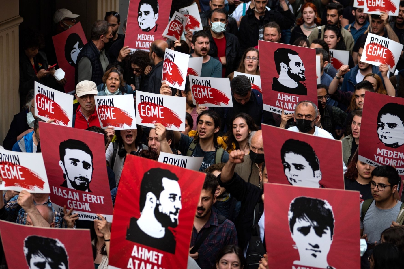 Protesters hold placards and shout slogans in Istanbul on April 26, 2022 during a rally in support of civil society leader Osman Kavala (AFP)