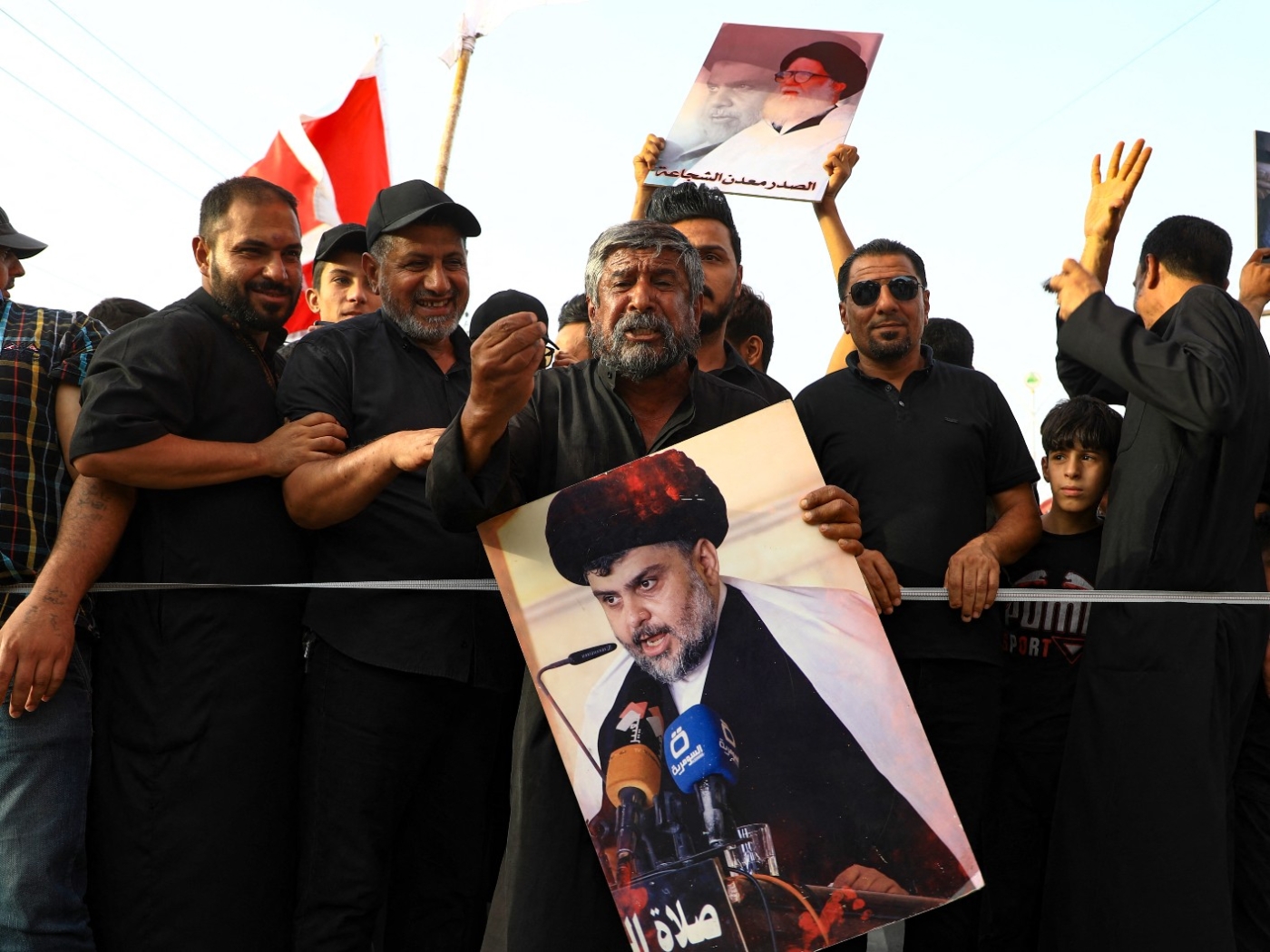 Supporters of Muqtada Sadr in the city of Nasiriyah on 14 August (AFP)