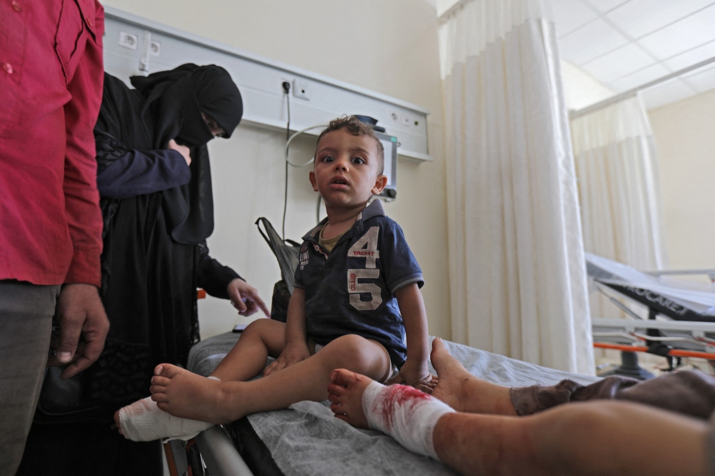 Children wounded in shelling during rebel infighting receive treatment at a hospital in al-Bab, 13 October (AFP)
