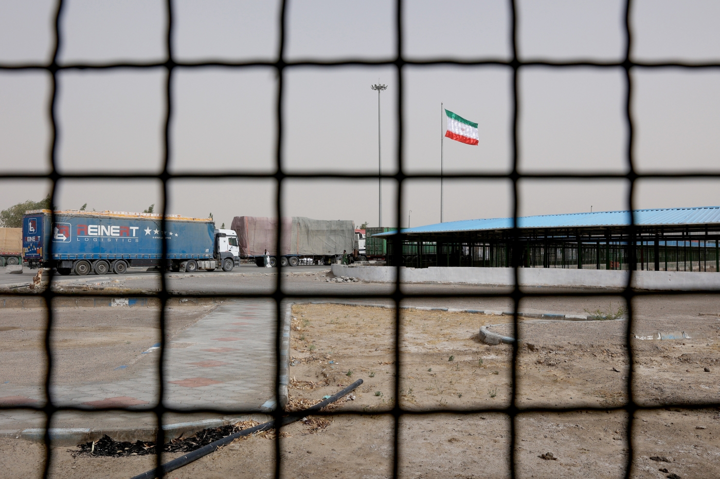 Iran's flag is pictured at the Milak border crossing between Iran and Afghanistan in the Sistan and Baluchestan Province on 8 September 2021 (Reuters)