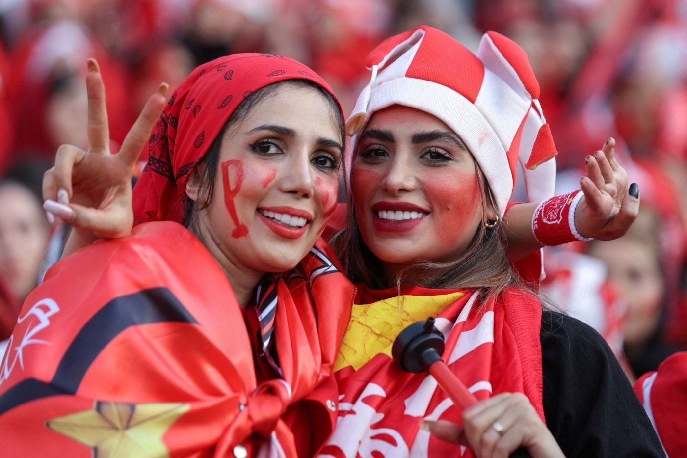 Iranian women attend a match between Persepolis and Sanat Naft-e Abadan teams at Azadi stadium in Tehran, 31 August (Reuters)
