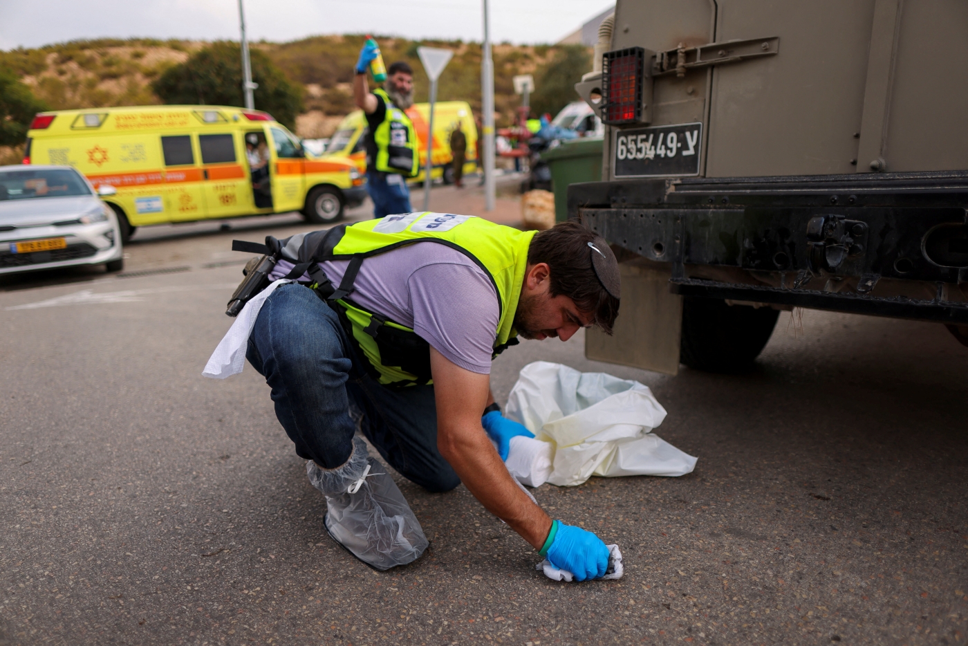 A member of an Israeli emergency response team works at the scene of an attack near the Ariel settlement in the Israeli-occupied West Bank 15 November 2022 (Reuters)