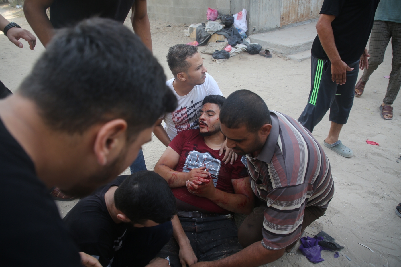 A wounded Palestinian man in Gaza City following an Israeli airstrike, on 5 August 2022 (MEE/Mohammed al-Hajjar)