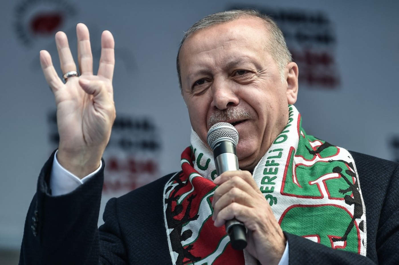 Turkish President Recep Tayyip Erdogan flashes four finger and makes the Rabia sign as he speaks during a pre-election rally at Bayrampasa district in Istanbul, on March 30, 2019. (AFP)