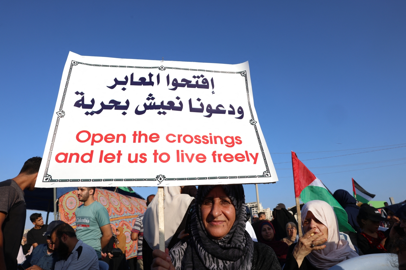Palestinians participate in a rally at the Gaza City sea port demanding the lifting of the 15-year Israeli blockade on 13 September 2022 (AFP)