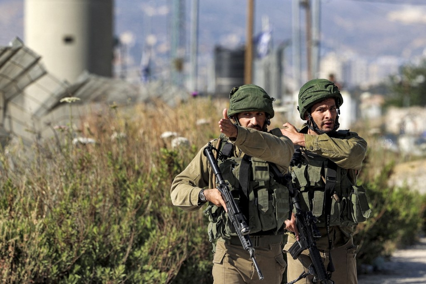 Israeli army soldiers manning the Huwara checkpoint near Nablus in the occupied West Bank on 17 May 2022 (AFP)