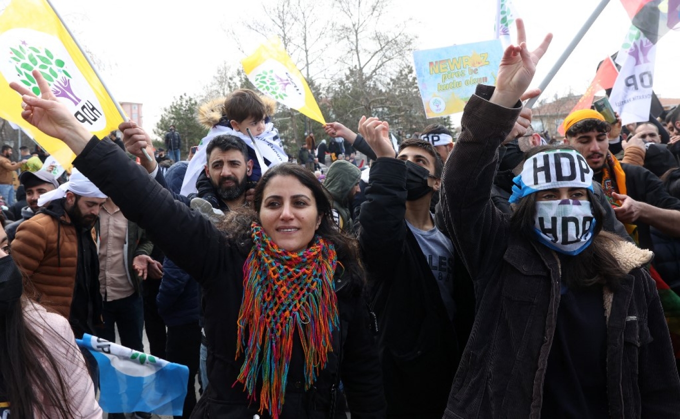 Supporters of Pro-Kurdish Peoples' Democratic Party (HDP) flash the V-sign for victory during a rally as they take part in the Kurdish celebration of Nowruz, the Persian New Year, in Ankara on March 20, 2022. (AFP)