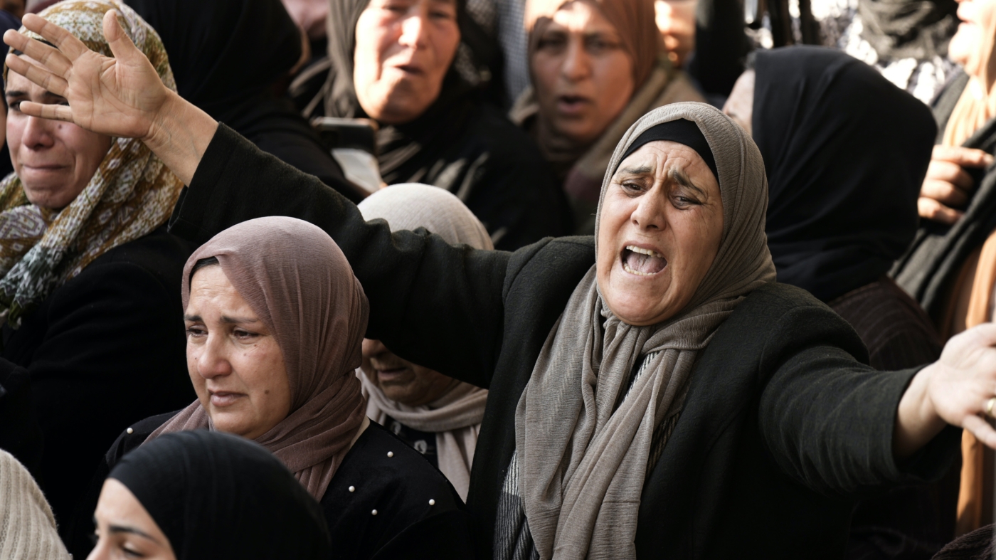 Palestinian women mourn Ahmed Daraghma during his funeral in the West Bank city of Nablus, 22 December 2022 (AP)