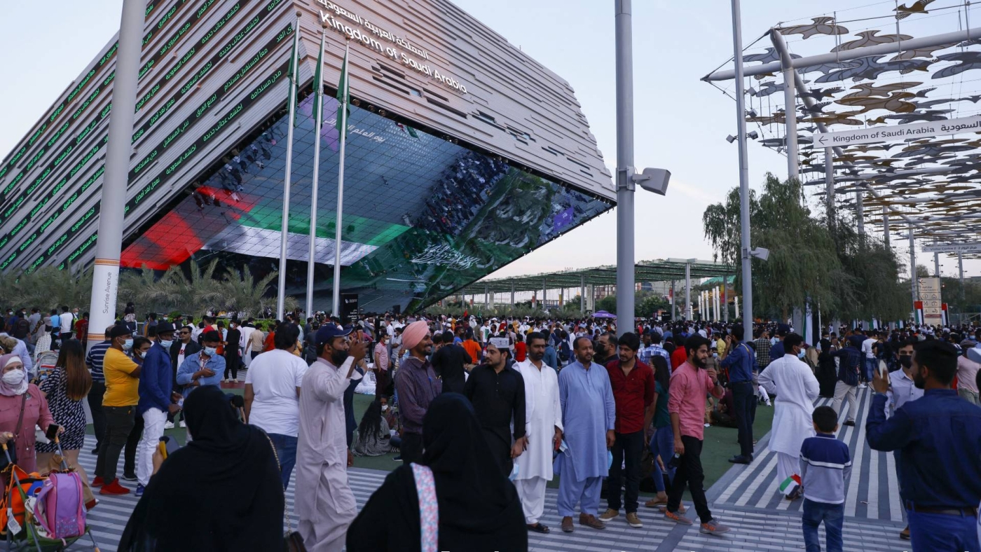 People walk near the Saudi pavilion at the Expo 2020, in the Gulf emirate of Dubai, on 2 December 2021