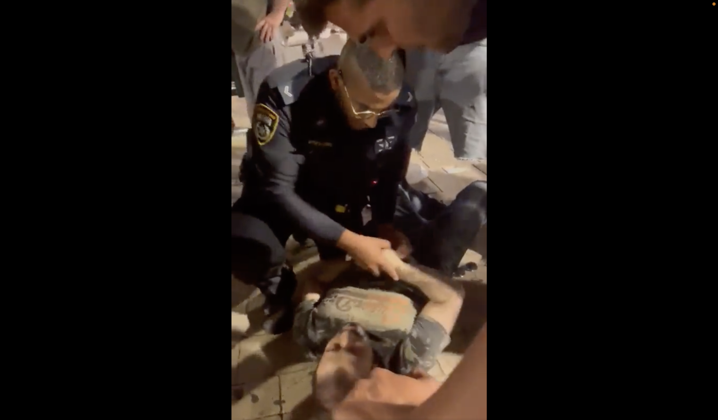 Israeli officer arresting UAE tourist