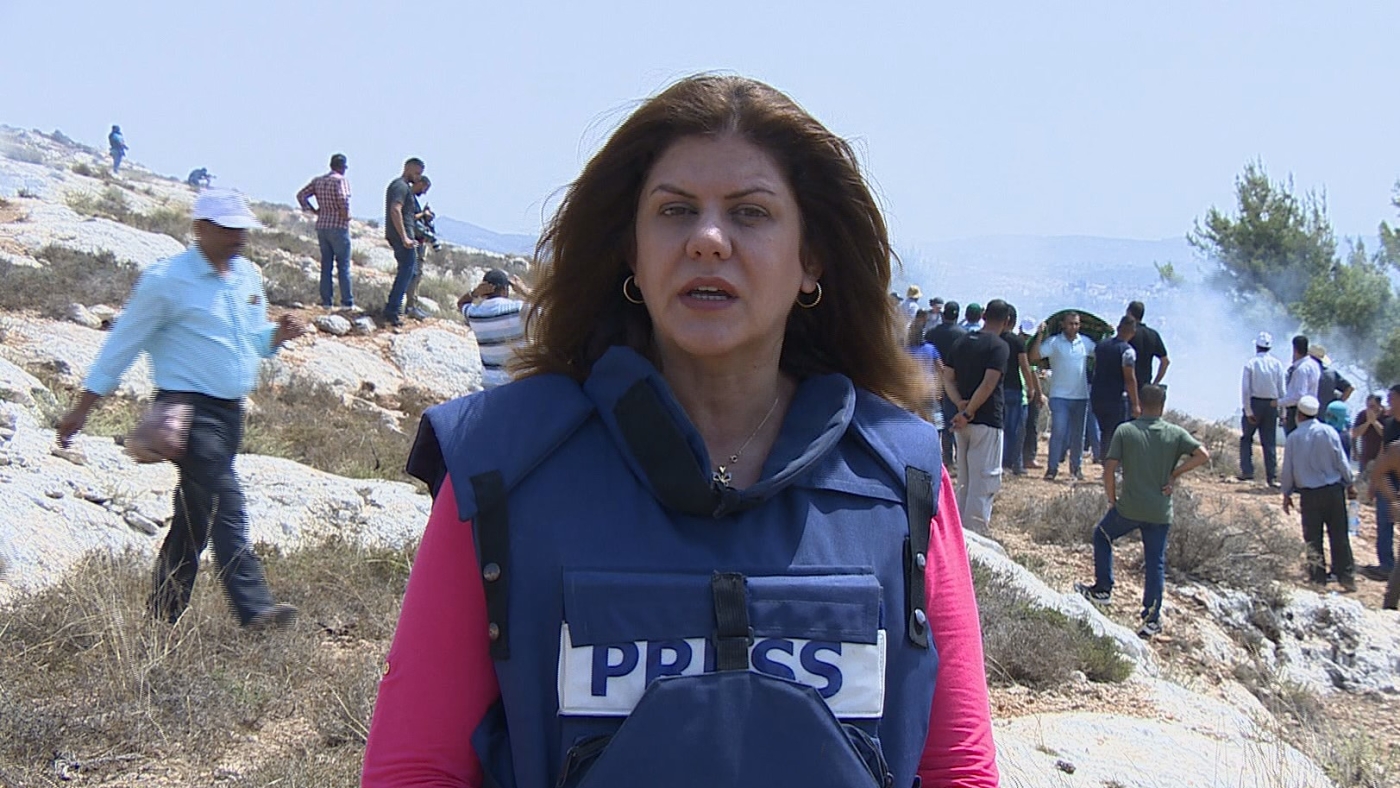 Shireen Abu Akleh, who was killed last week in Jenin, wearing a press vest while reporting for the Al Jazeera news channel (Courtesy: Al Jazeera)