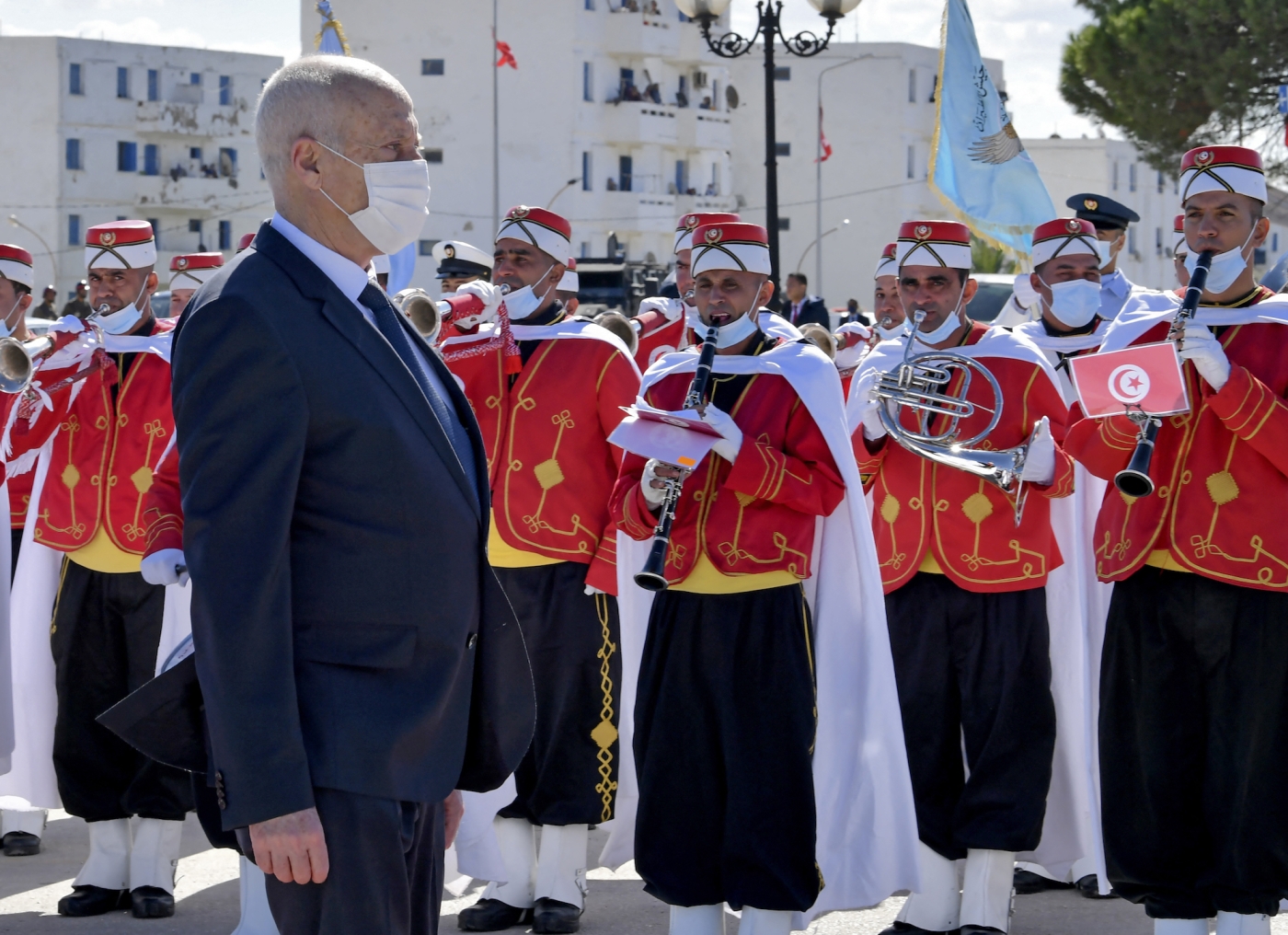 Tunisian President Kais Saied reviews honour guards at an Evaculation Day commemoration ceremony in the northern town of Bizerte on 15 October 2021 (AFP)