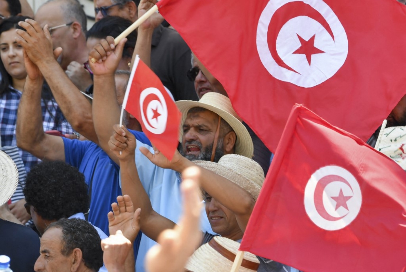 Tunisian protesters chant slogans against President Kais Saied and the upcoming constitutional referendum to be held on 25 July, at a rally in the capital Tunis, 19 June 2022 (AFP)