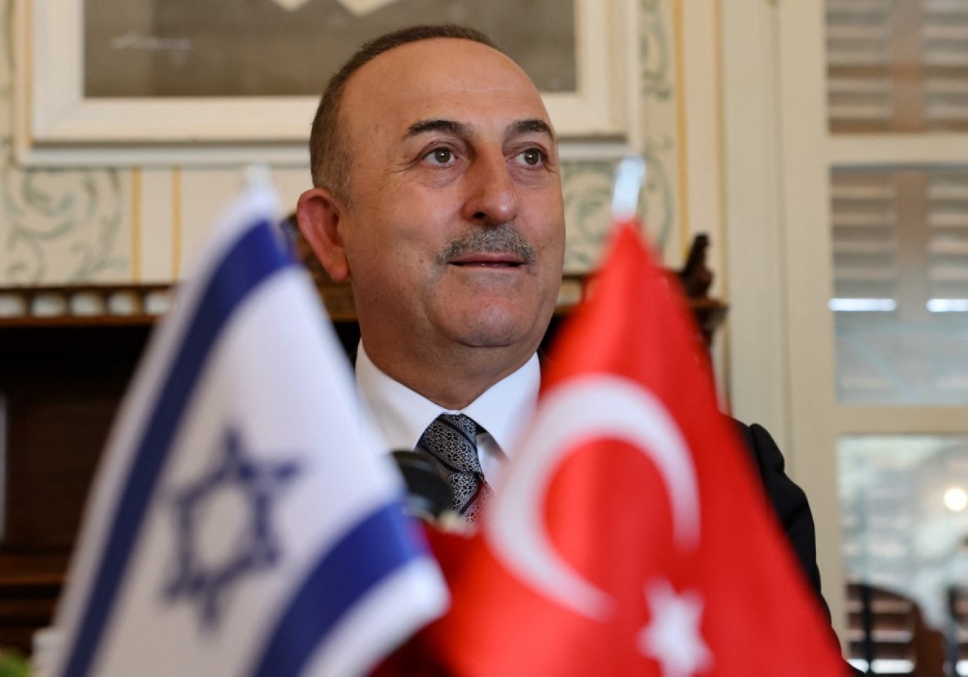 Turkish Foreign Minister Mevlut Cavusoglu gives an opening statement before meeting with Israeli and Turkish businessmen, in the coastral city of Tel Aviv, on May 25, 2022. (AFP)