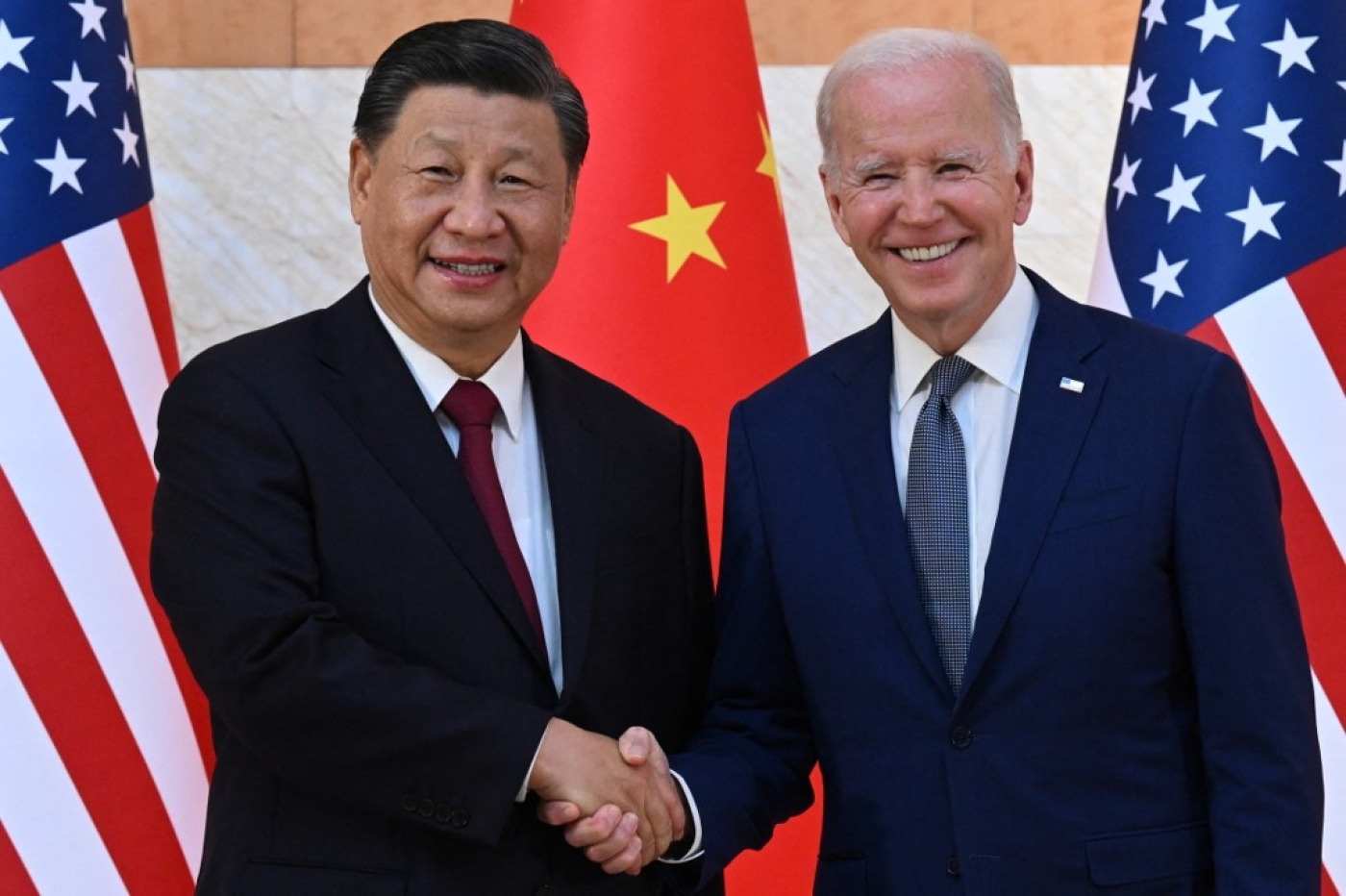 US President Joe Biden (R) and China's President Xi Jinping (L) meet at the G20 Summit on the Indonesian island of Bali on 14 November 2022 (AFP)