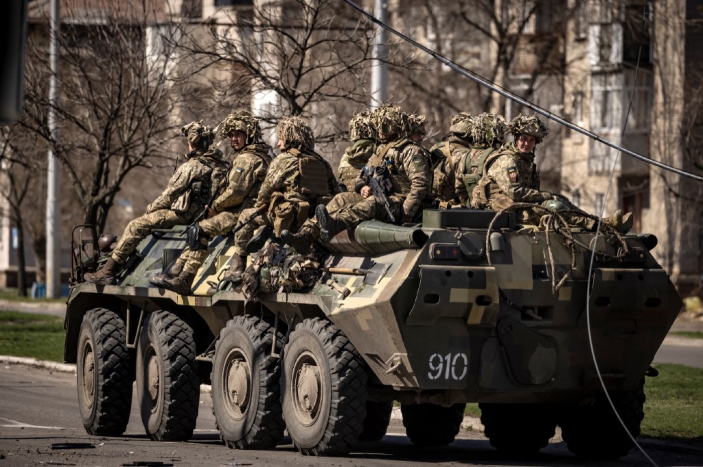Ukrainian soldiers ride on a armoured military vehicle in the city of Severodonetsk, Donbas region, 7 April 2022 (AFP)