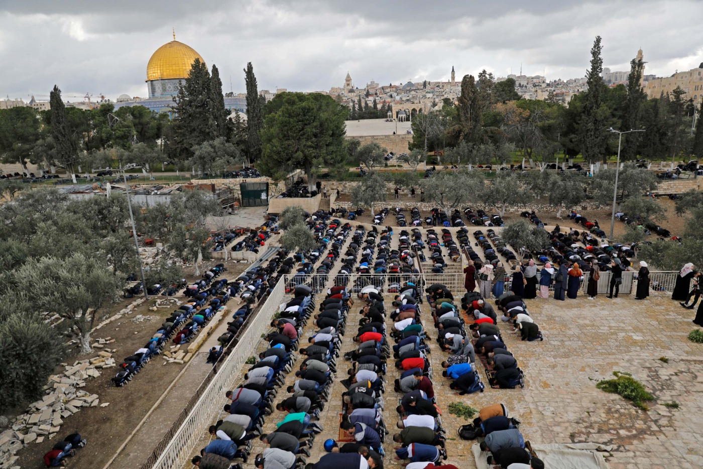 Palestinians Muslim worshippers pray in the Al-Aqsa Mosque compound in the Old City of Jerusalem, on 22 February 2019 (AFP)