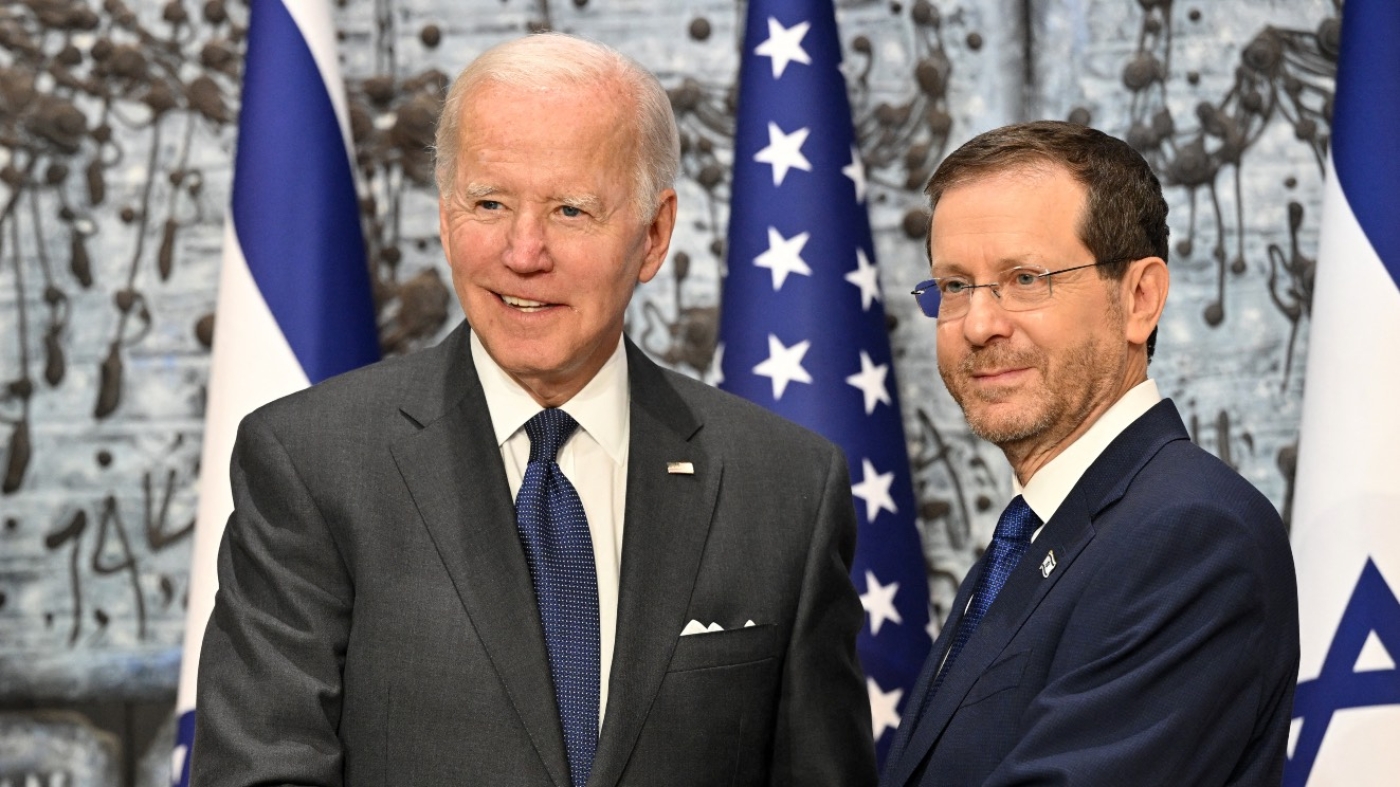 US President Joe Biden shakes hands with Israeli President Isaac Herzog (R) at the presidential residence in Jerusalem, on 14 July 2022.