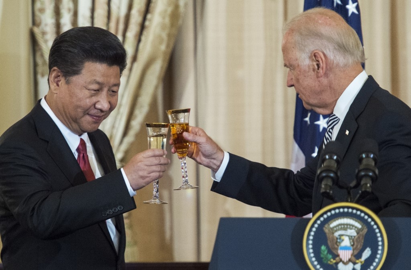 Biden, then vice-president, and Chinese President Xi Jinping toast during a state luncheon in September 2015.