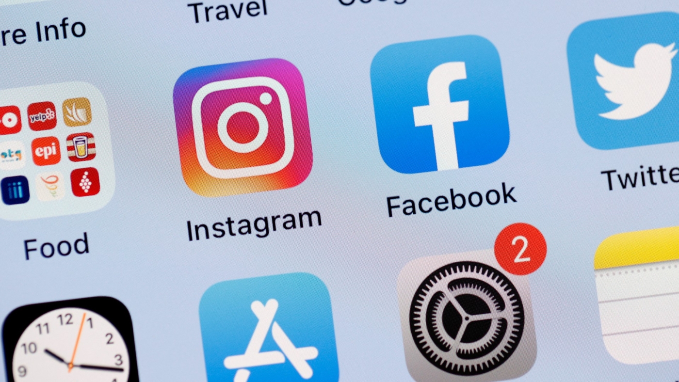 The Facebook and Instagram apps are seen on the screen of an iPhone (AFP)